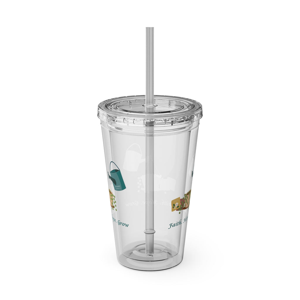 Clear tumbler with a straw on a white background