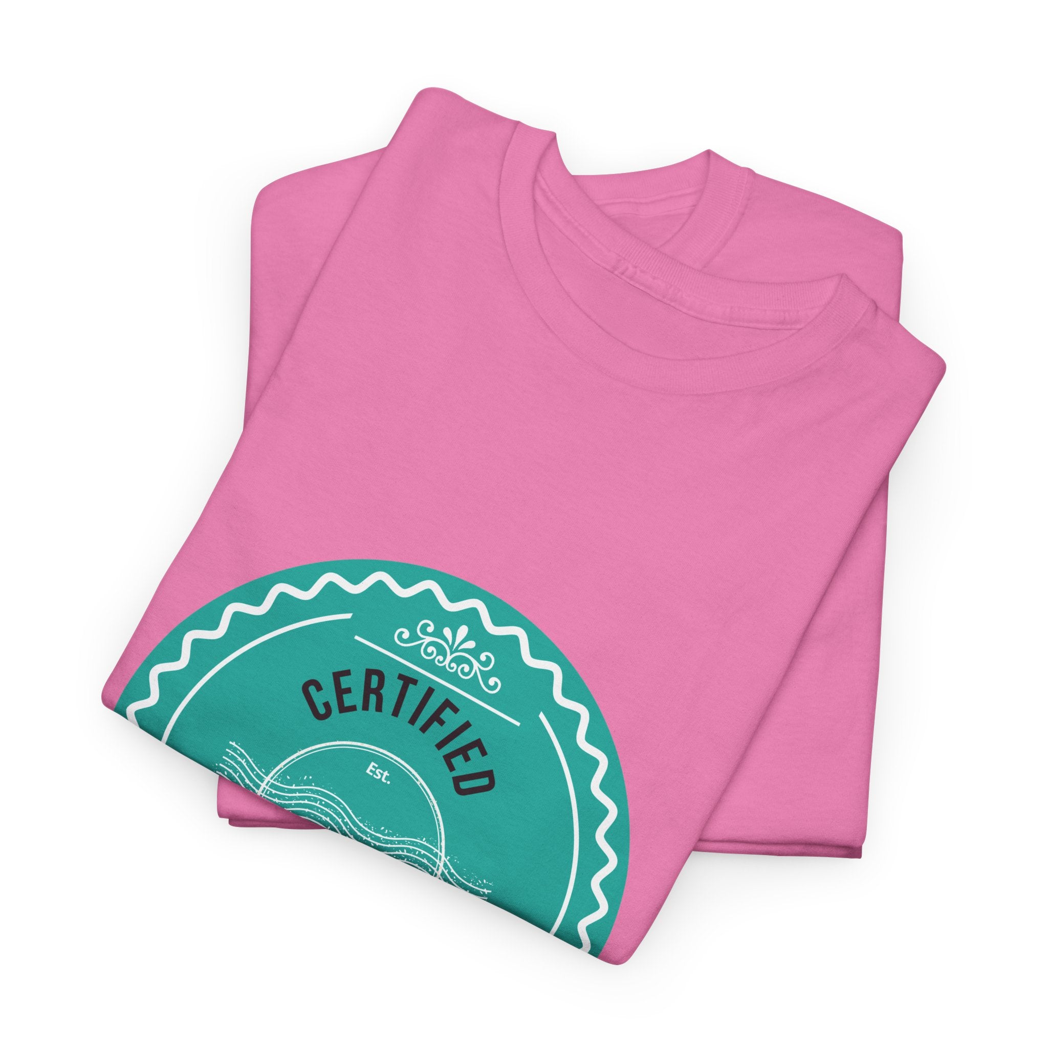 folded Pink t-shirt with a teal 'Certified' label on a white background