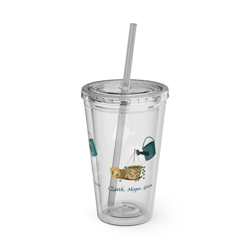 Clear tumbler with a straw, featuring illustrations and text on a white background