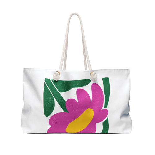 back view of White tote bag with colorful floral design on a white background