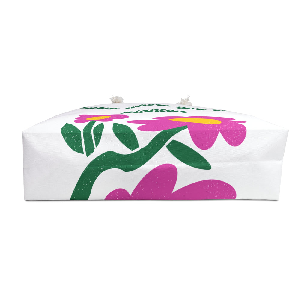 bottom of white tote bag with floral design on a white background