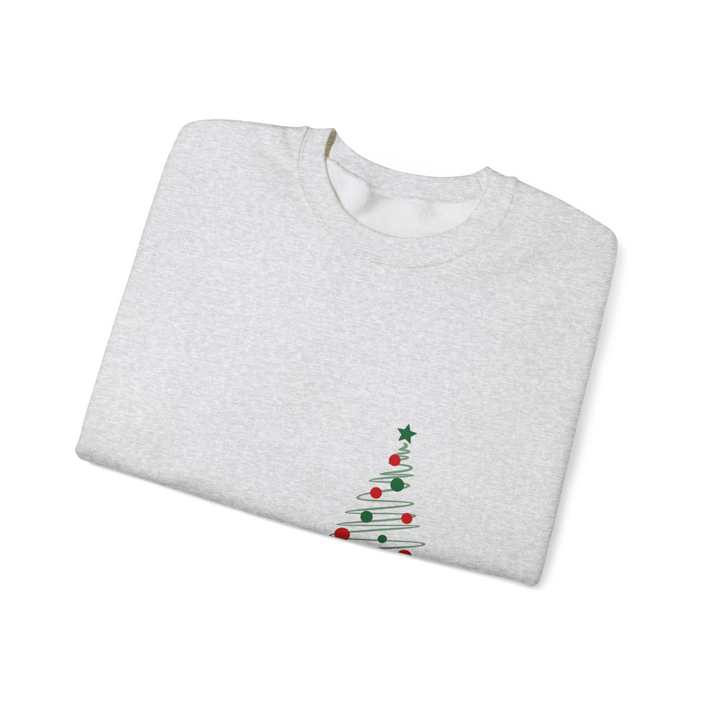 Folded gray sweatshirt with a Christmas tree design on a white background