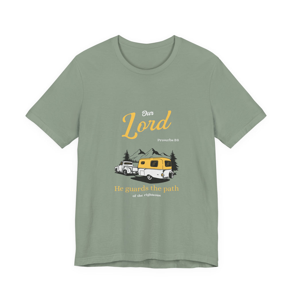 Green t-shirt with a graphic design of a camper van and mountains on a white background