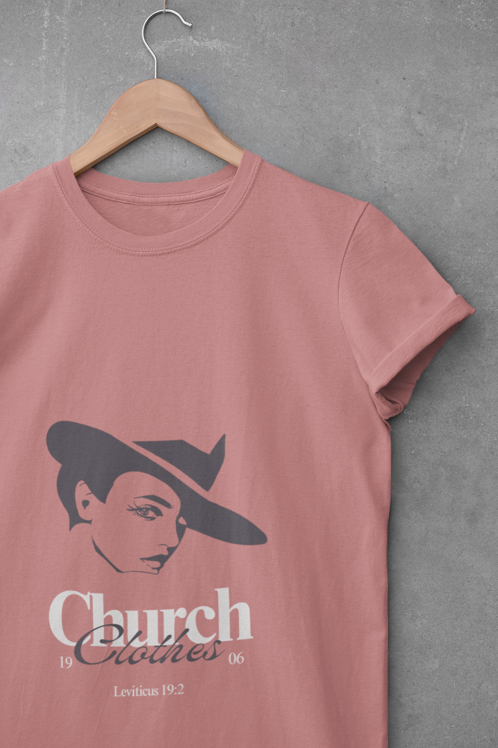 mauve t-shirt with a graphic design and text on a gray background