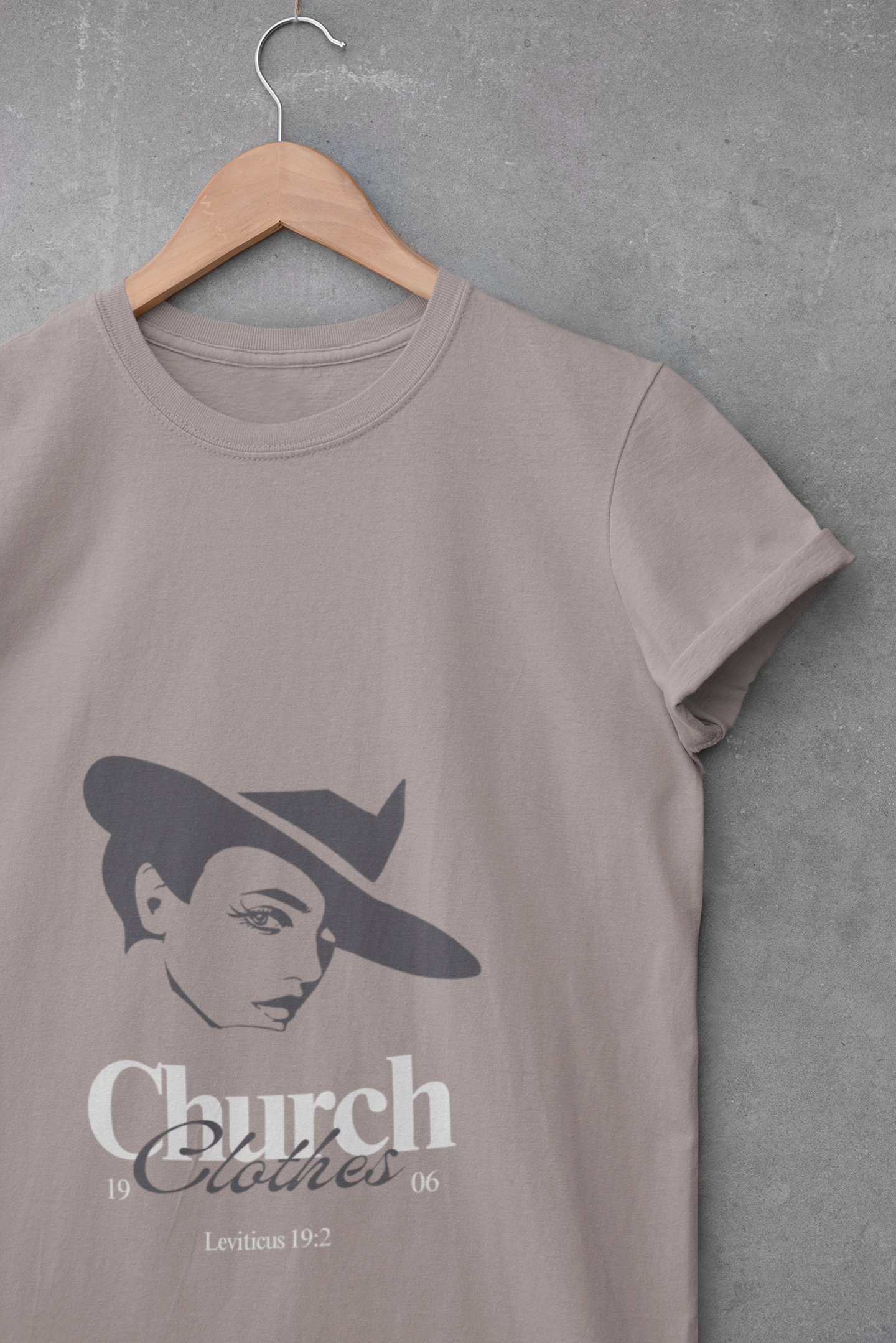 Brown t-shirt with a graphic design of a woman's face and 'Church Clothes' text on a gray background.