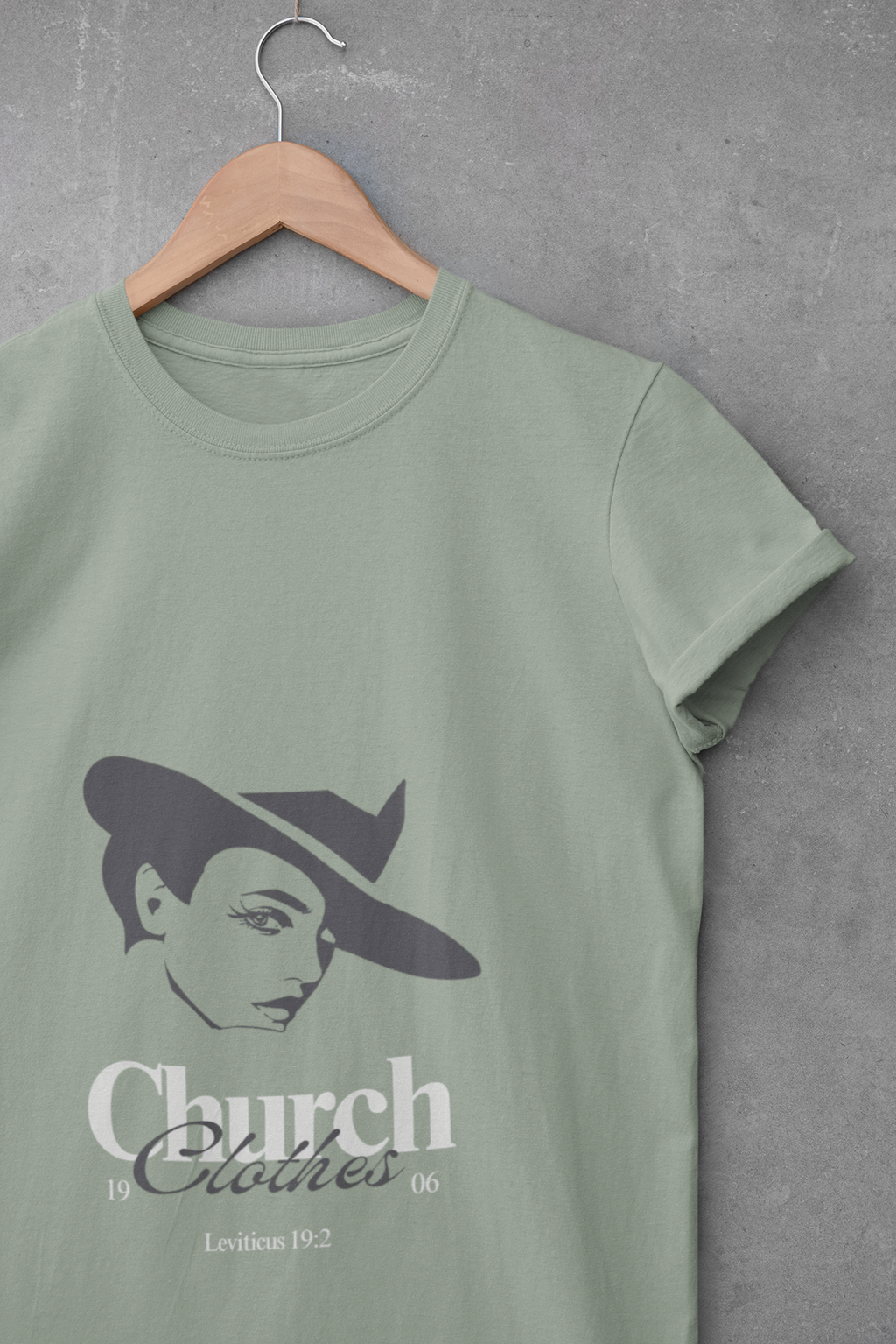 Green t-shirt with a graphic design and text on a gray background