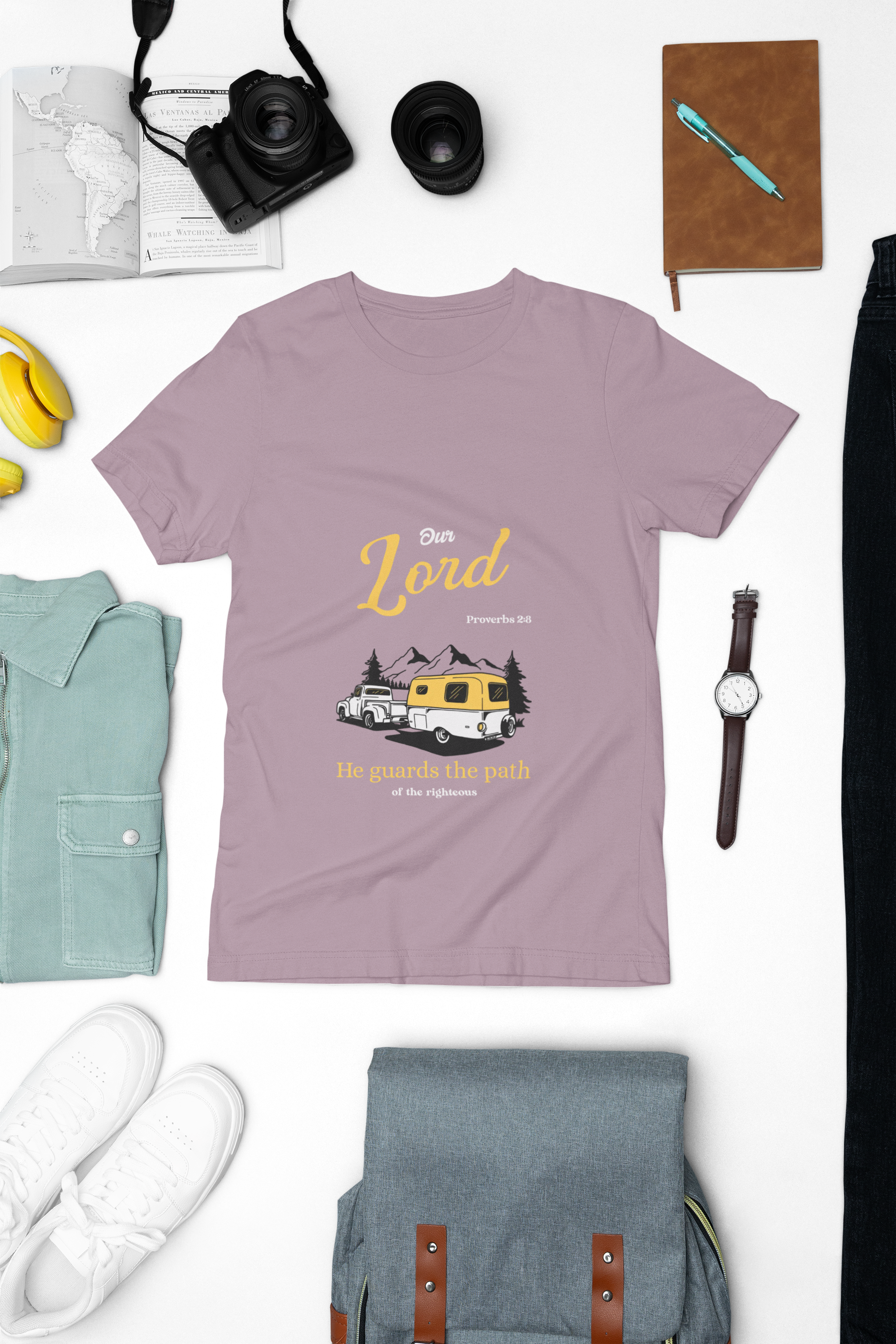 light Purple t-shirt with graphic design and text on a white background with accessories around