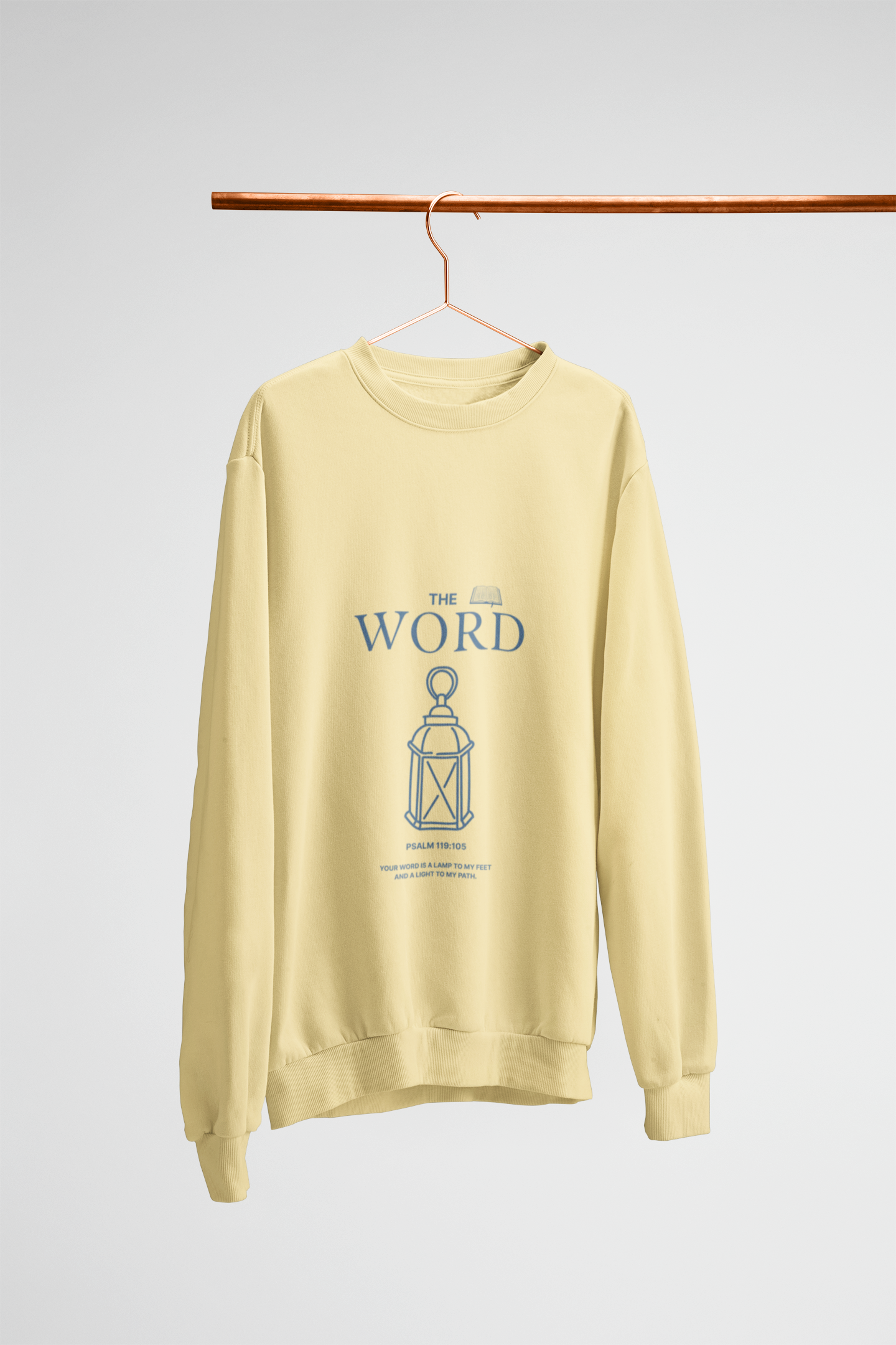 yellow sweatshirt with blue text and graphic on a hanger against a white background