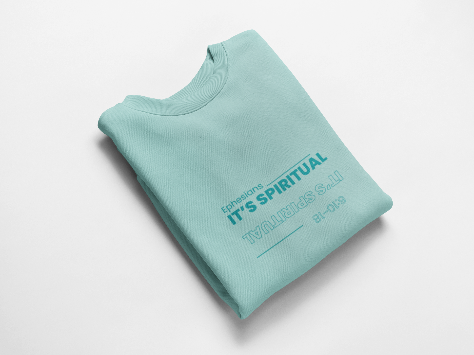 Folded light blue sweatshirt with text on a white background