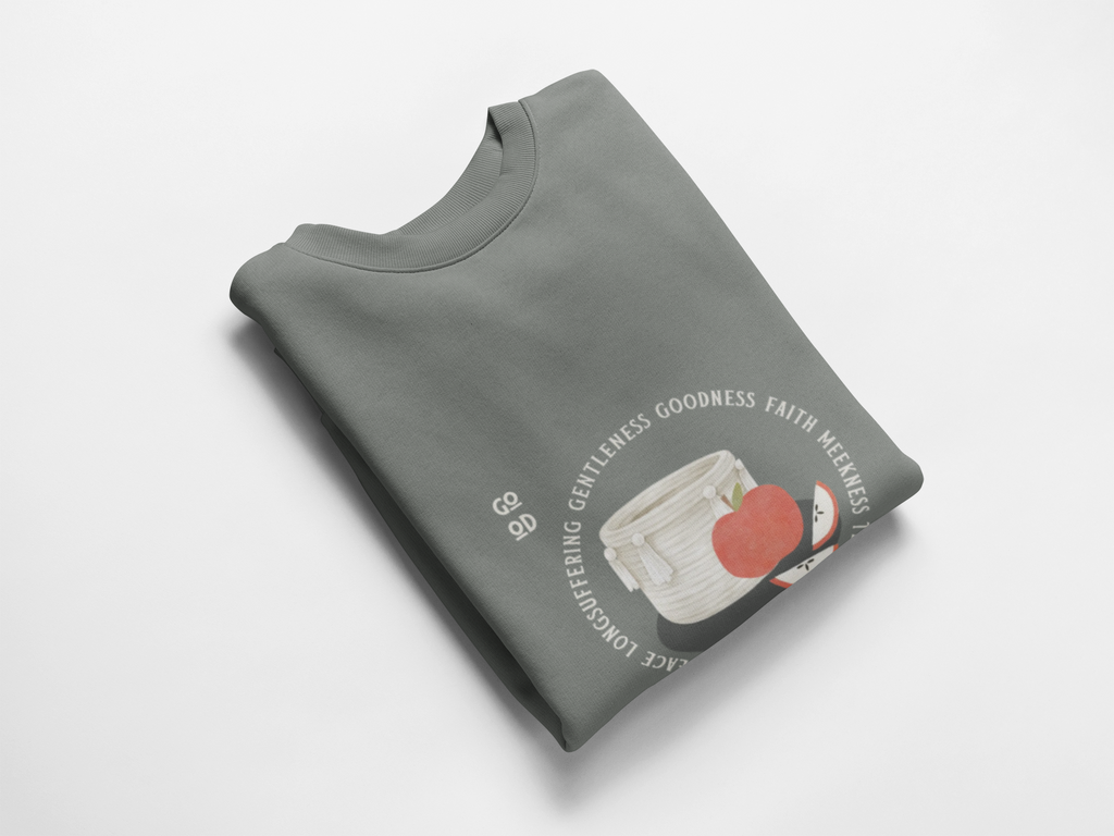 Folded gray sweatshirt with graphic design on a white background
