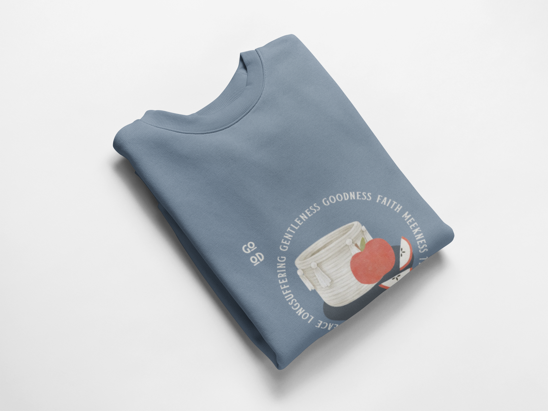 Folded blue sweatshirt with graphic design on a white background