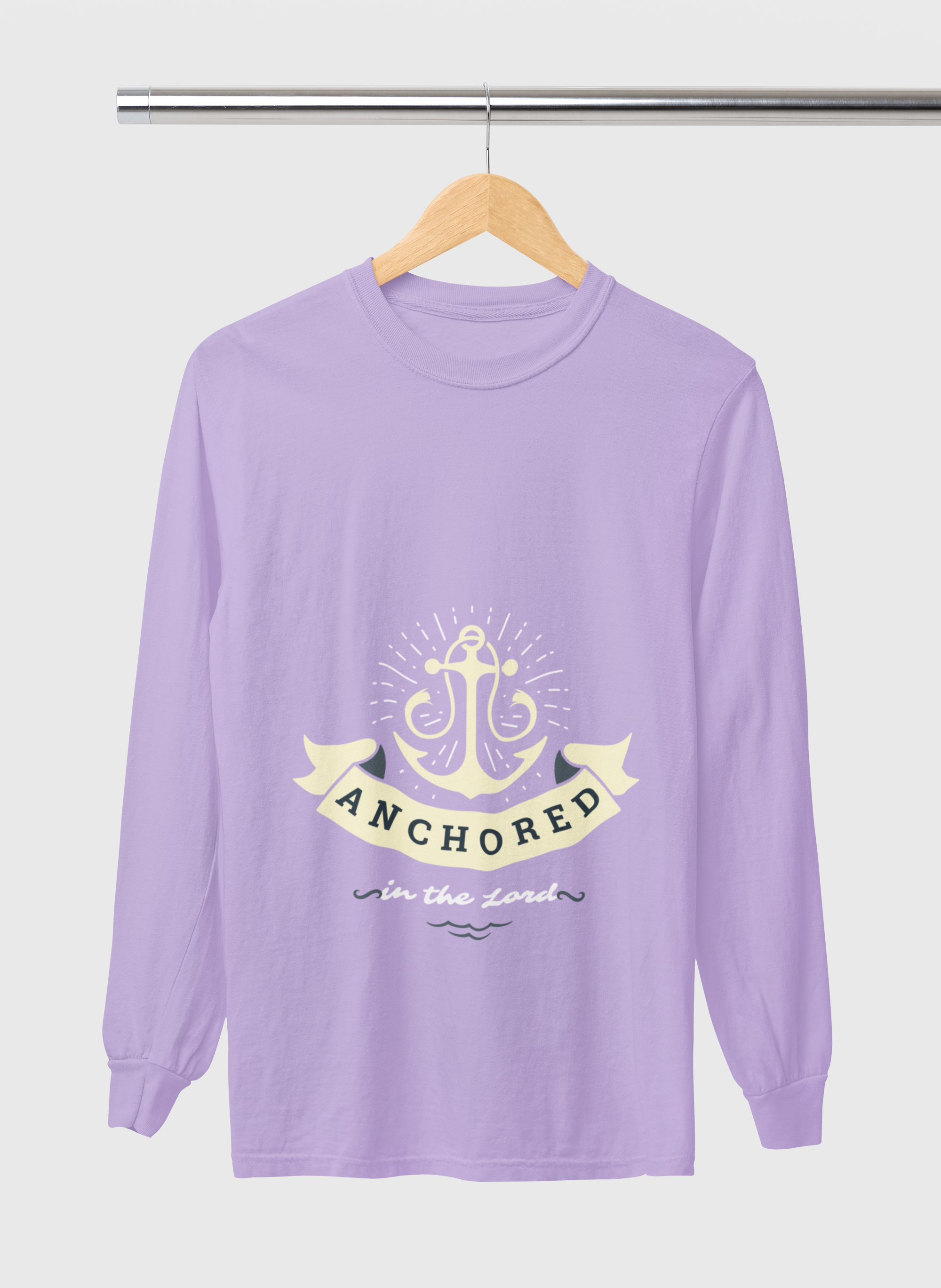 Purple long-sleeve shirt with anchor design and text on a hanger against a white background