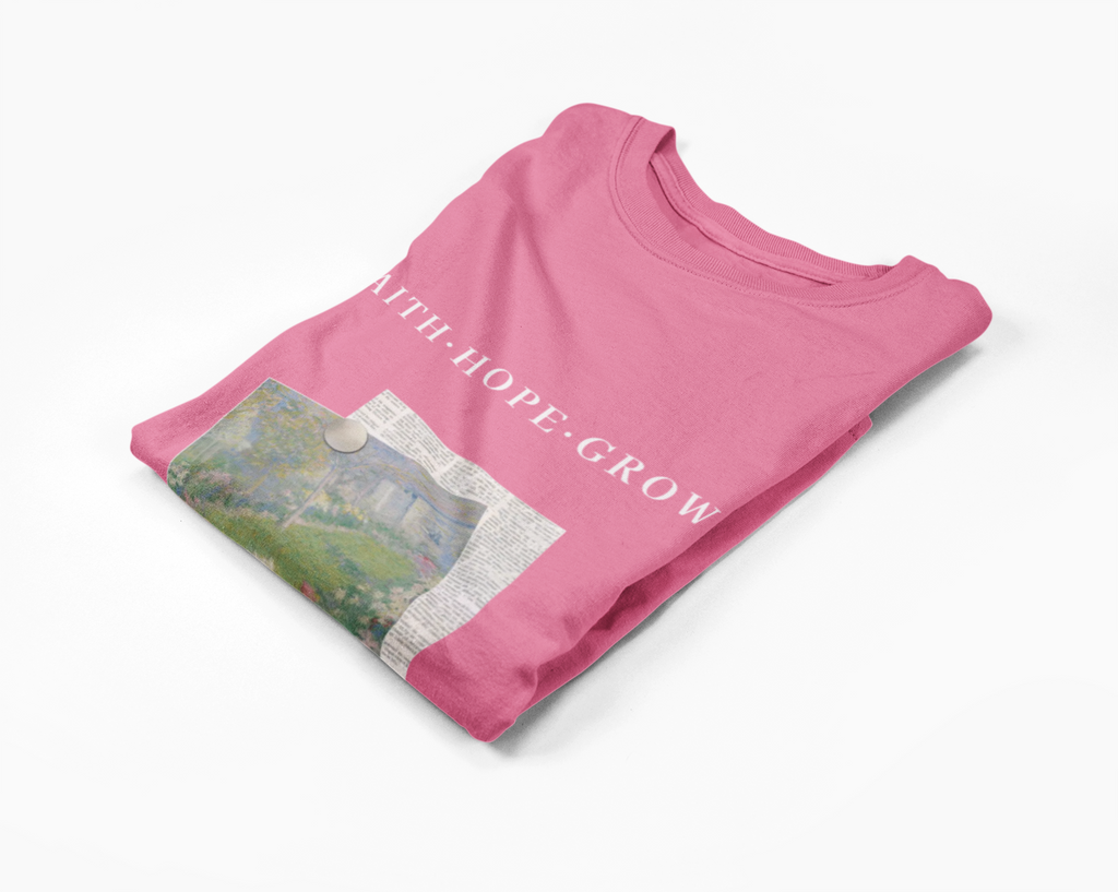 Pink t-shirt with printed design and text on a white background