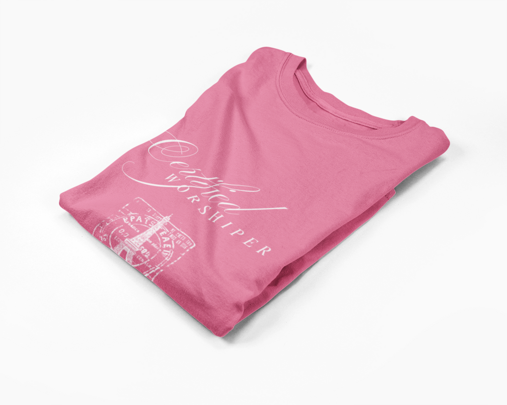 Pink shirt with white text and graphics on a white background
