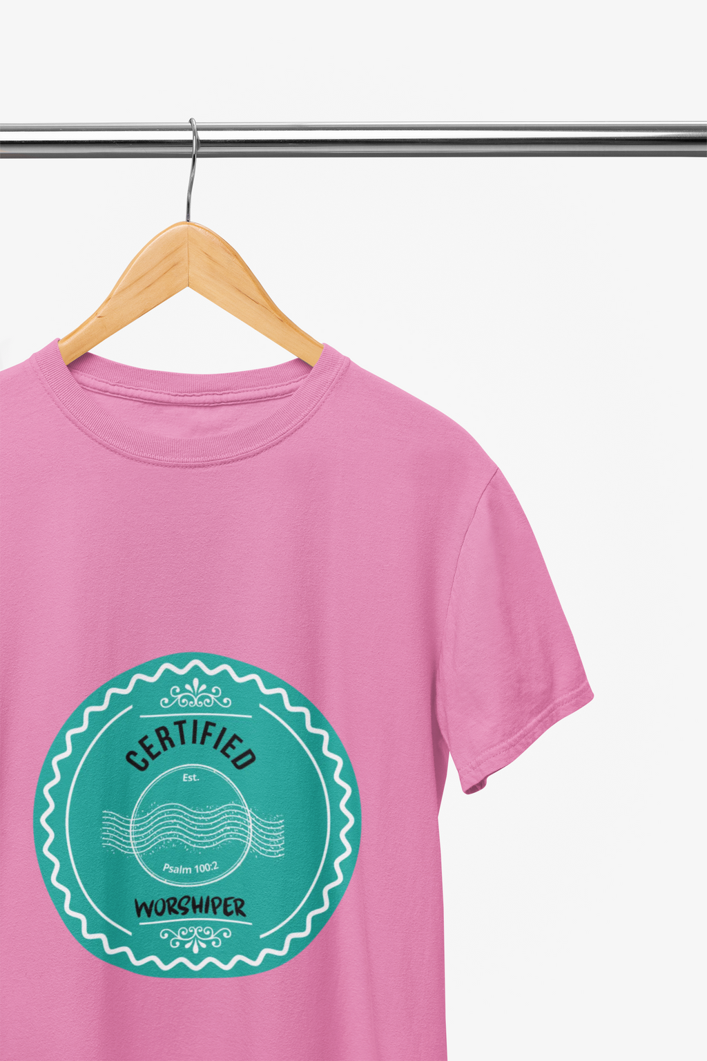 Pink t-shirt with a teal graphic and text on a hanger against a white background
