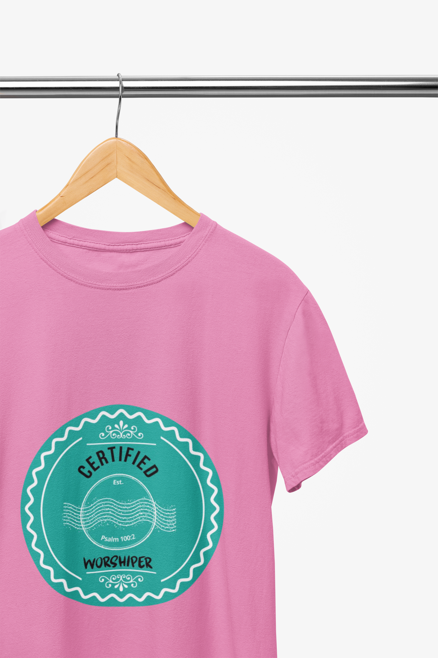 Pink t-shirt with a teal graphic and text on a hanger against a white background