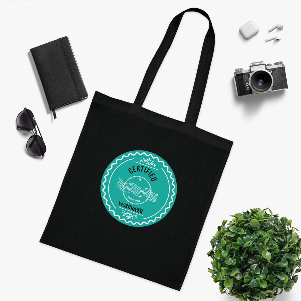 Black tote bag with a teal logo on a white background