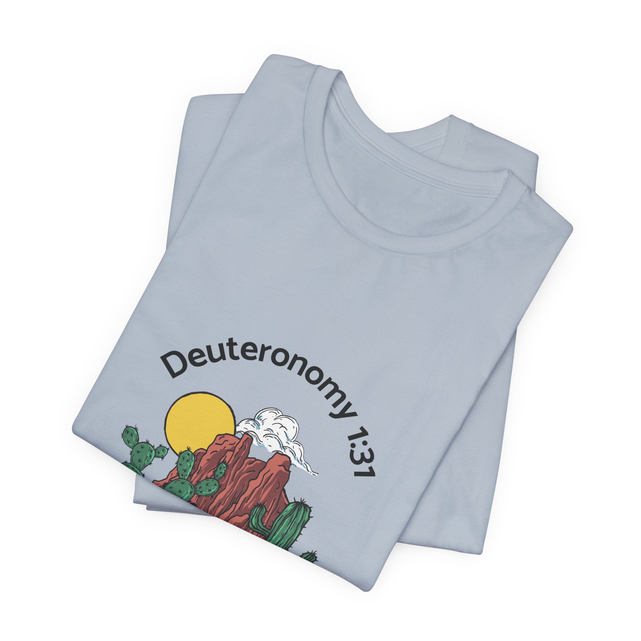 Folded light blue t-shirt with a graphic design and text on a white background