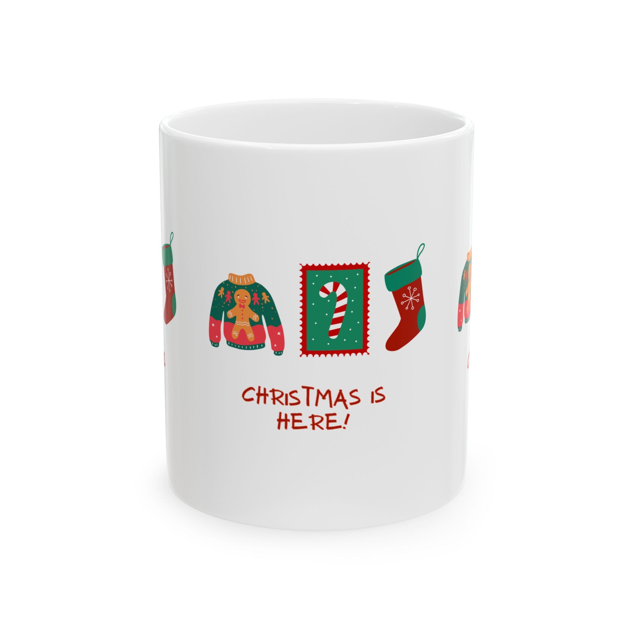 White mug with Christmas-themed designs and 'Christmas is Here!' text on a white background