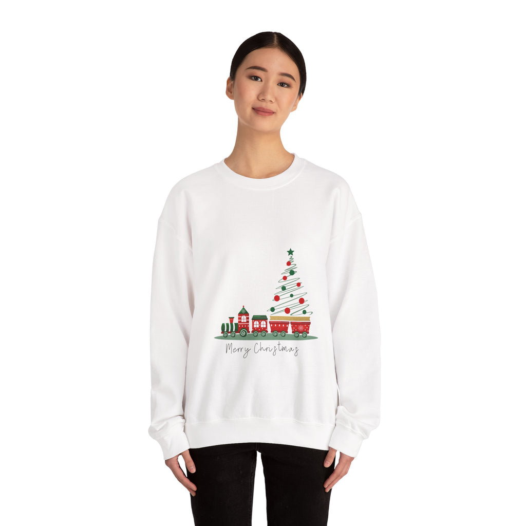 White sweatshirt with Christmas tree and train design worn by a person on a white background