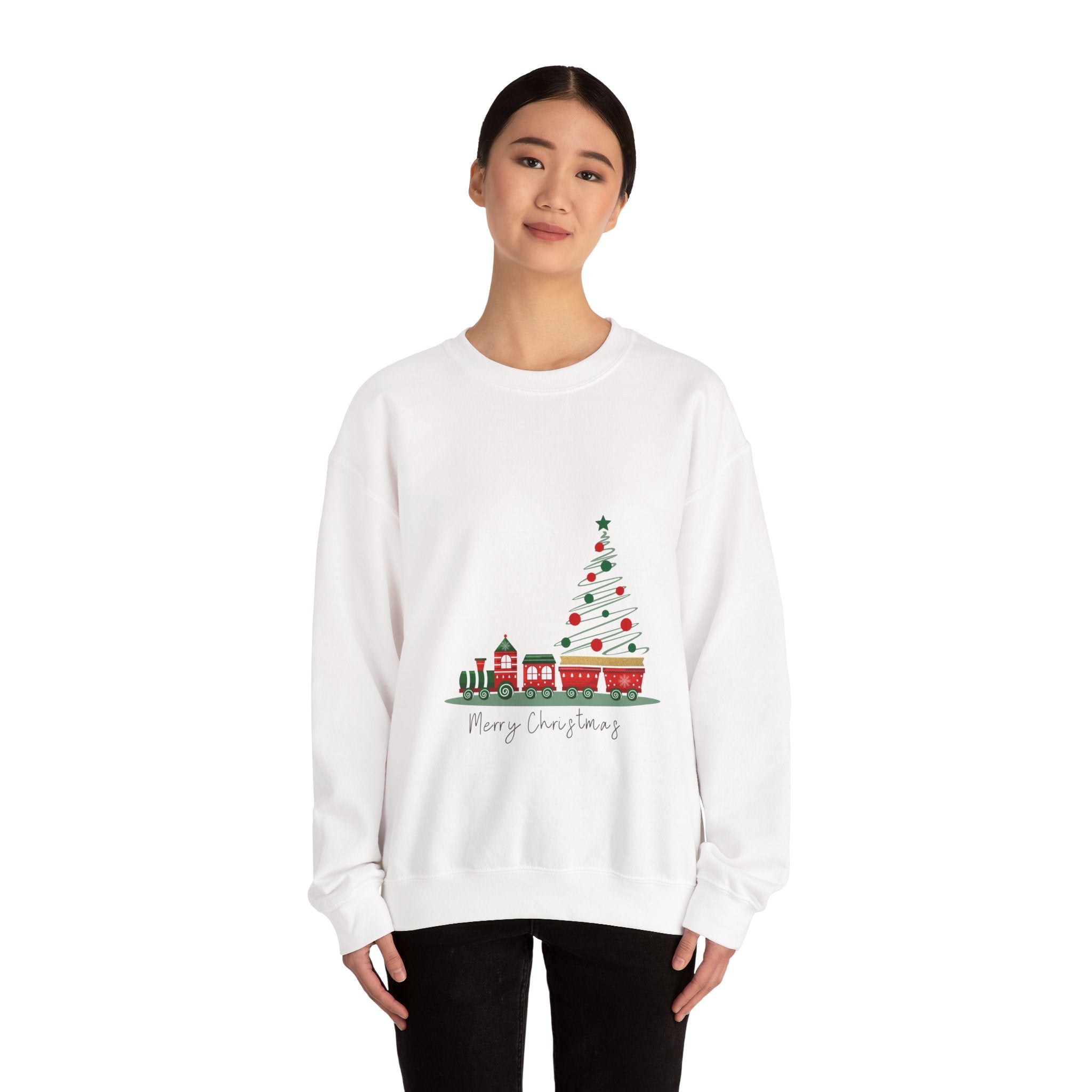 White sweatshirt with Christmas tree and train design worn by a person on a white background