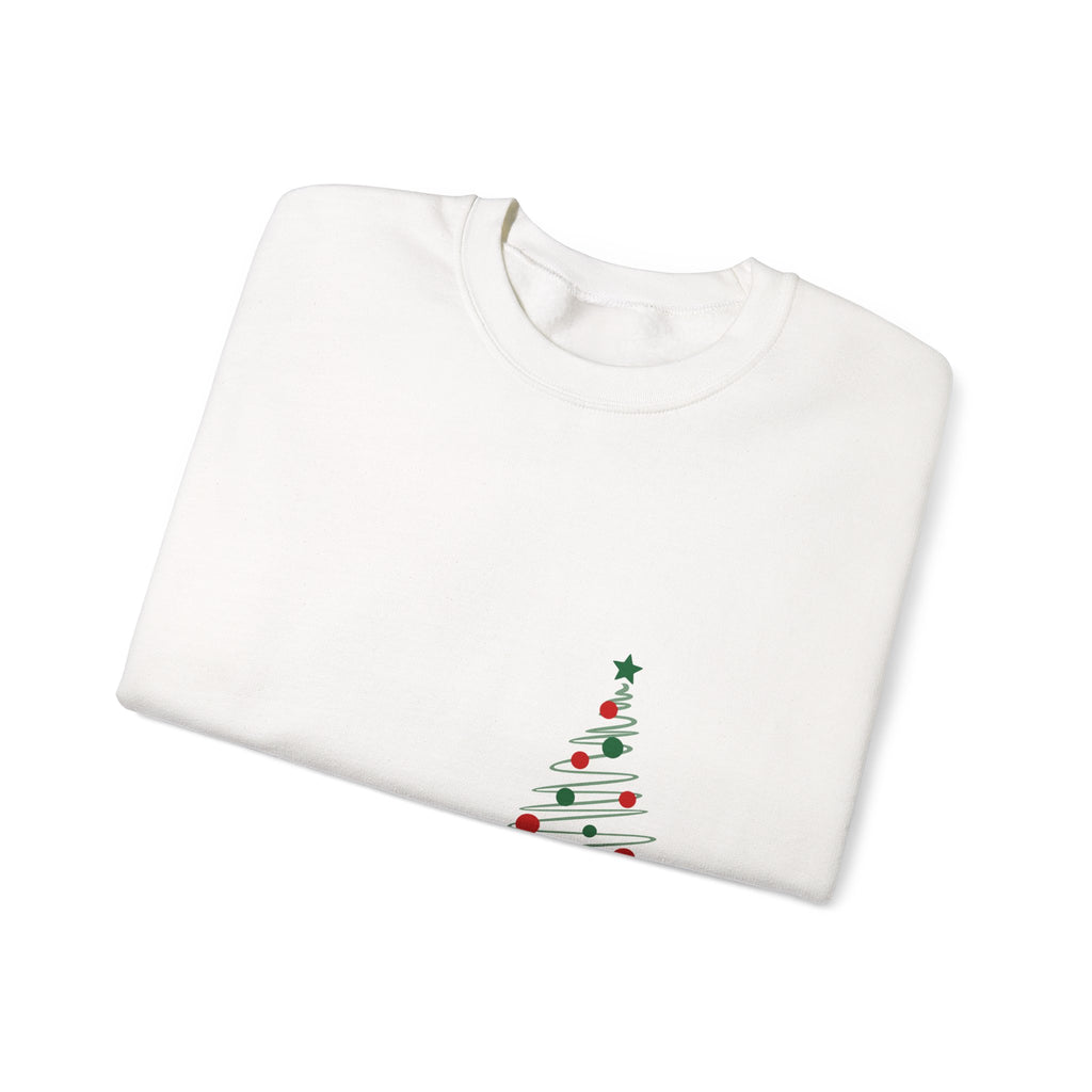 folded White sweatshirt with a Christmas tree design on a white background
