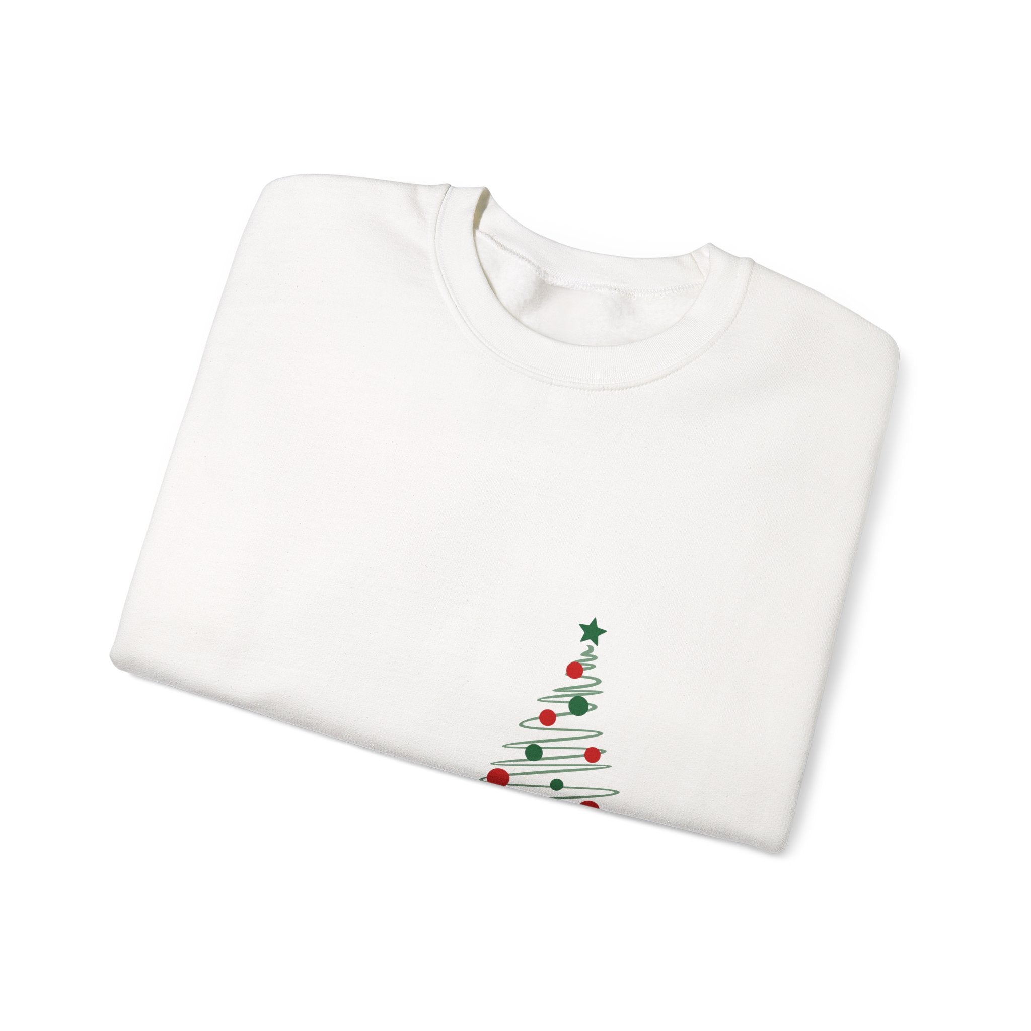 folded White sweatshirt with a Christmas tree design on a white background