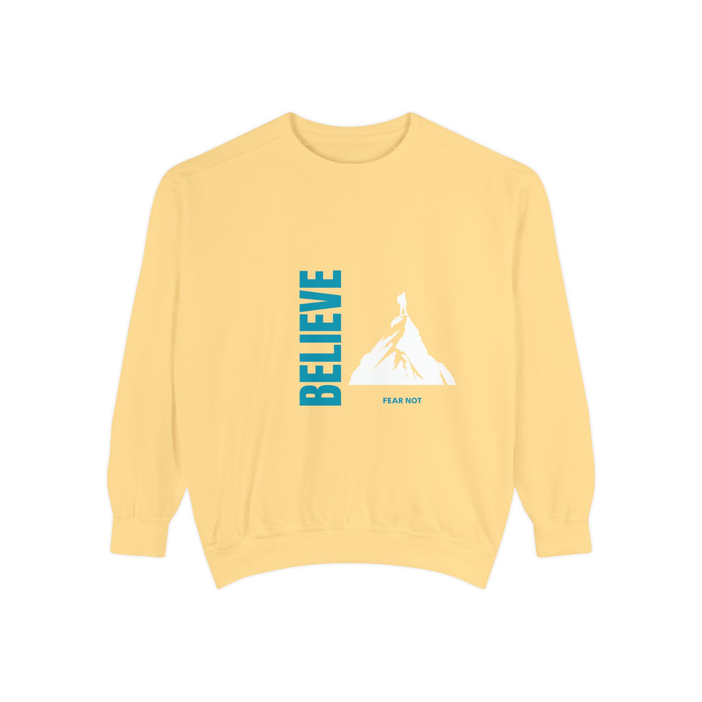 Yellow sweatshirt with 'BELIEVE' text and mountain graphic on a white background