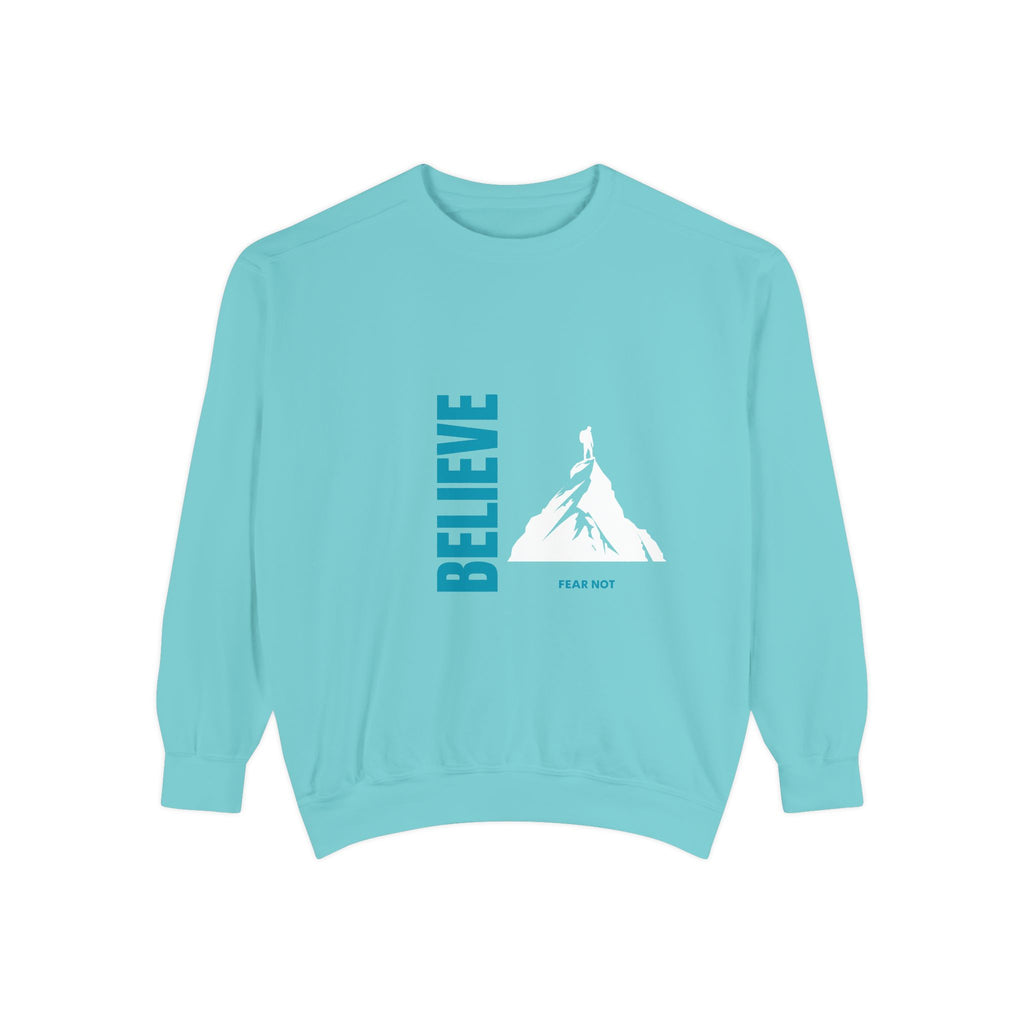 Light blue sweatshirt with mountain graphic and 'BELIEVE' text on a white background