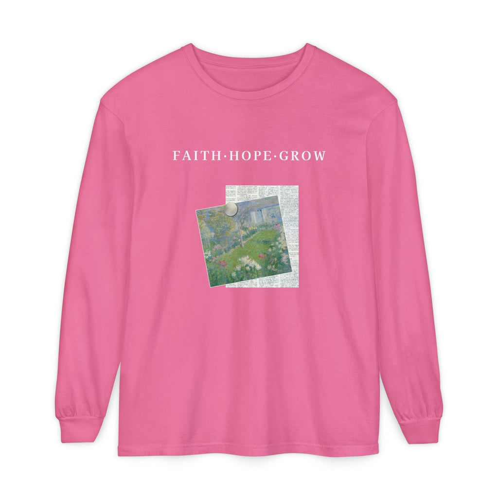 Pink long-sleeve shirt with 'FAITH HOPE GROW' text and a graphic design on a white background
