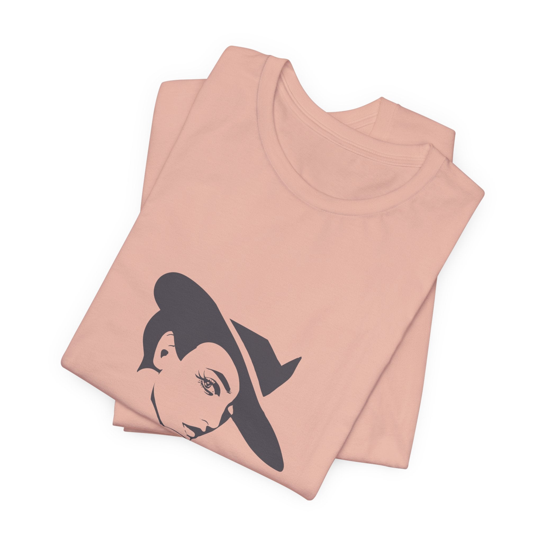 Folded peach t-shirt with a graphic design on a white background