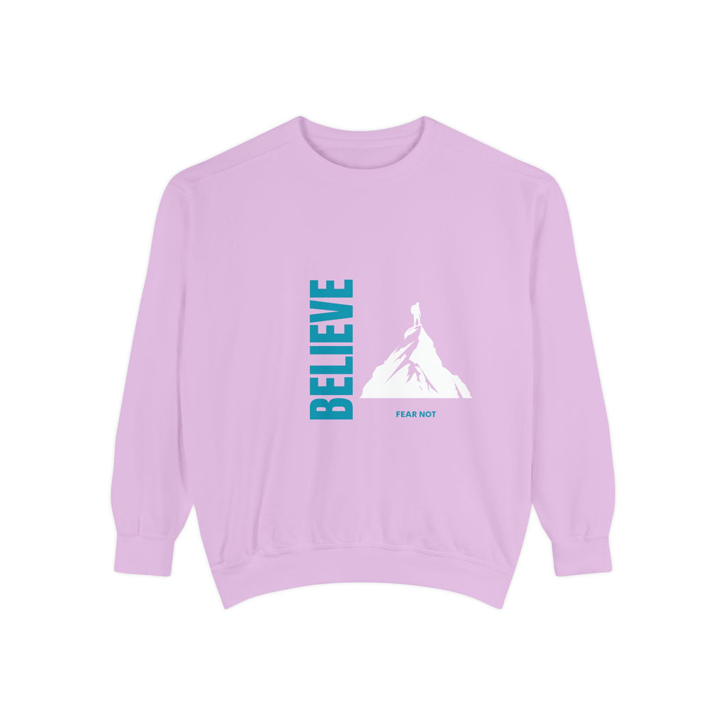light purple sweatshirt with 'BELIEVE' and mountain graphic on a white background