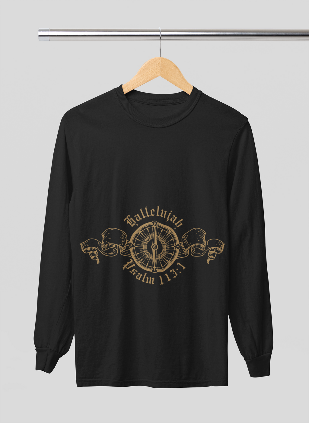 Black long-sleeve shirt with gold design on a hanger against a gray background
