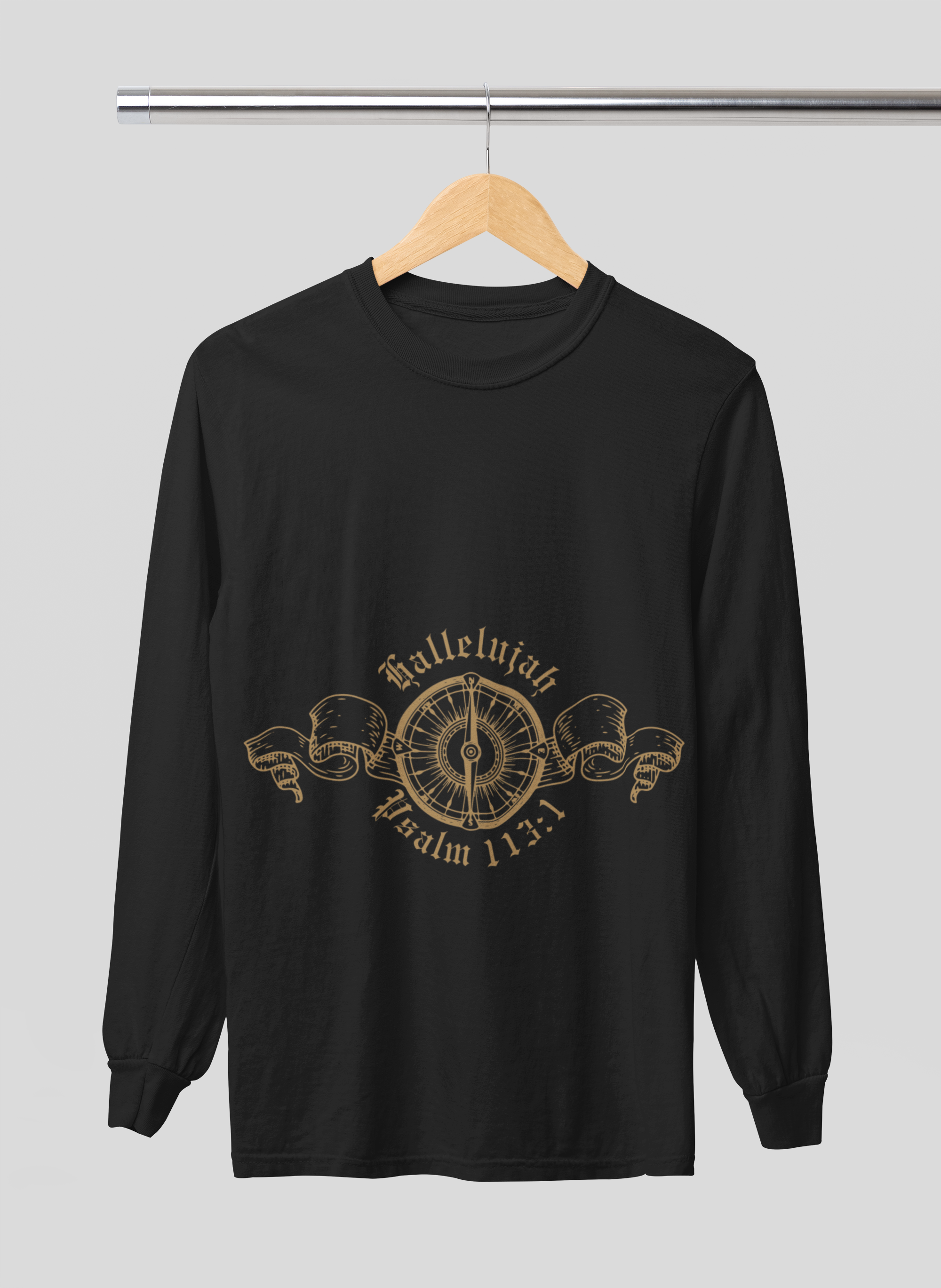 Black long-sleeve shirt with gold design on a hanger against a gray background
