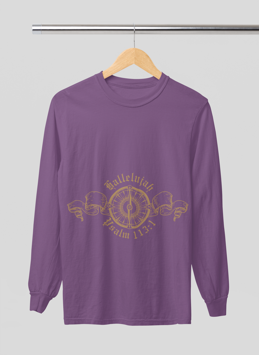 Purple long-sleeve shirt with gold design on a hanger against a gray background