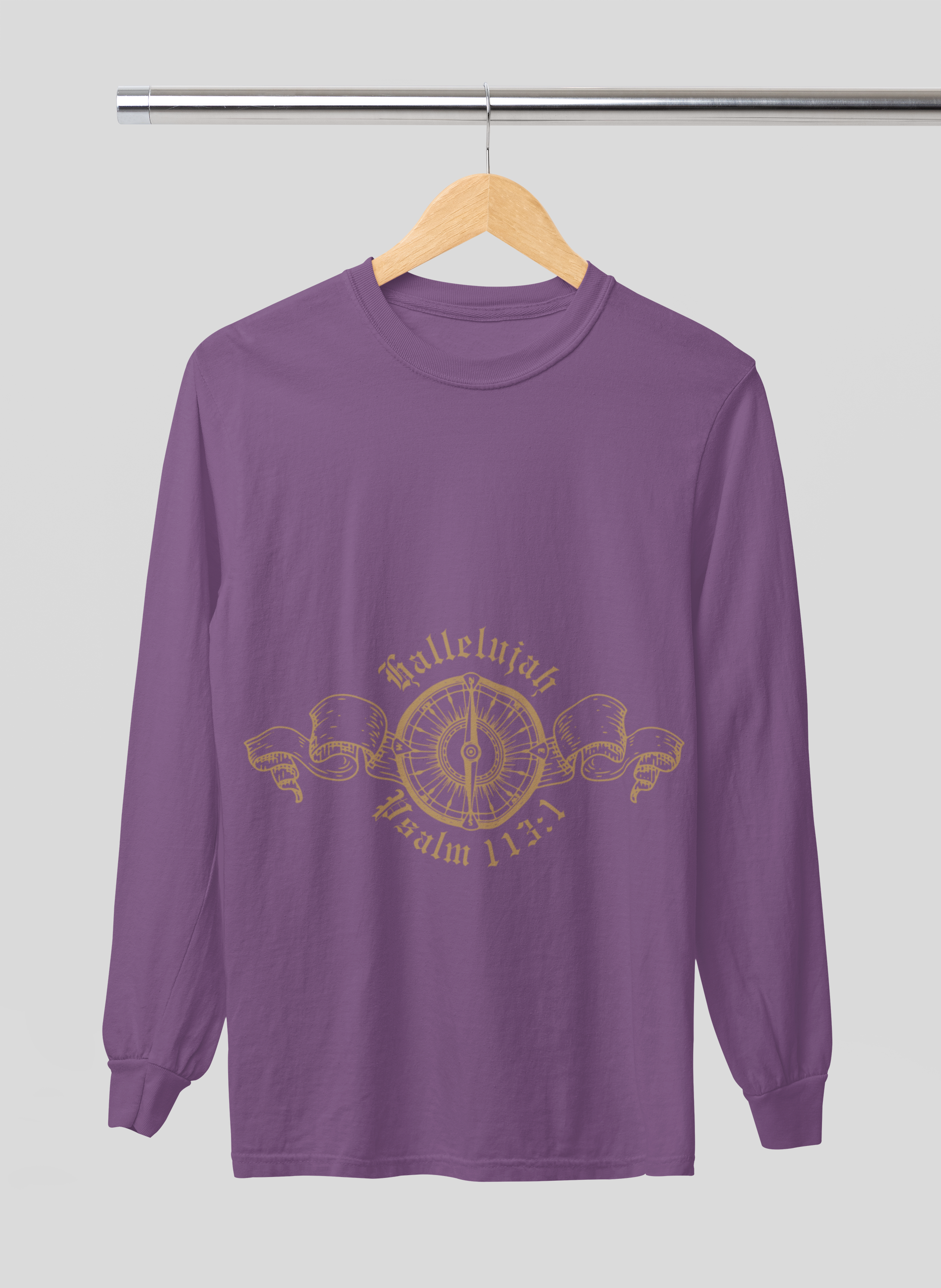 Purple long-sleeve shirt with gold design on a hanger against a gray background