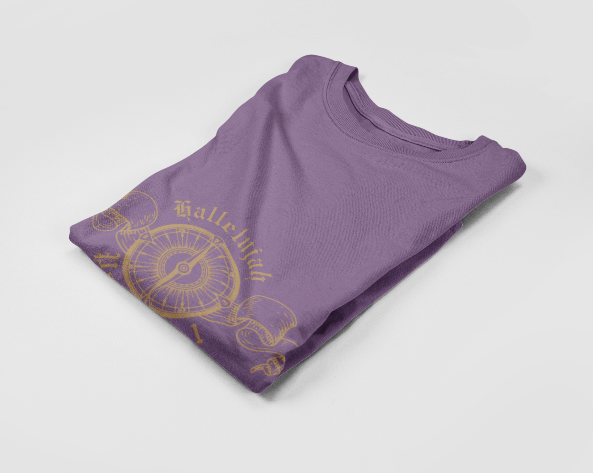 Folded purple t-shirt with gold design on a light gray background