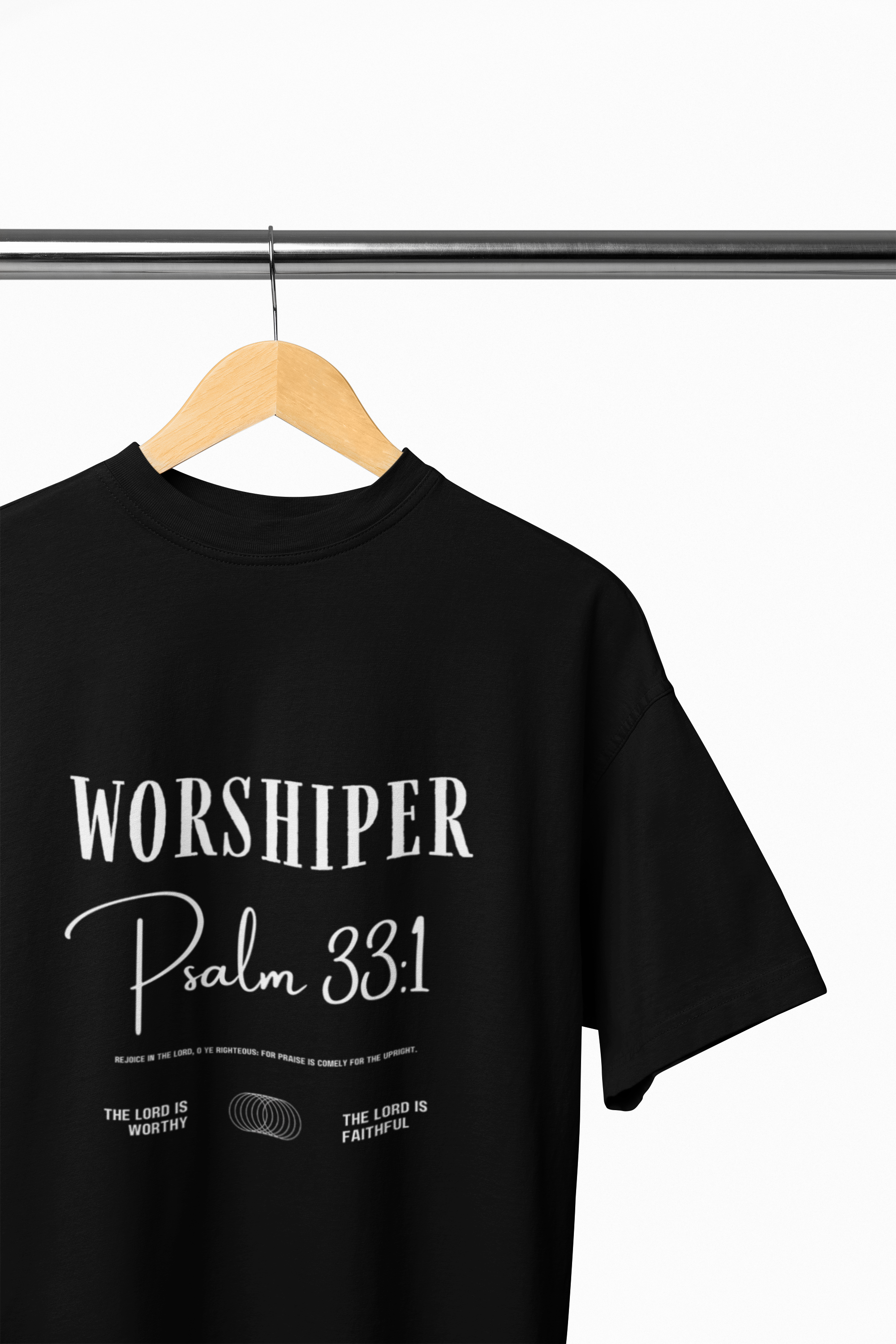 Black t-shirt with 'Worshiper Psalm 33:1' text on a hanger against a white background