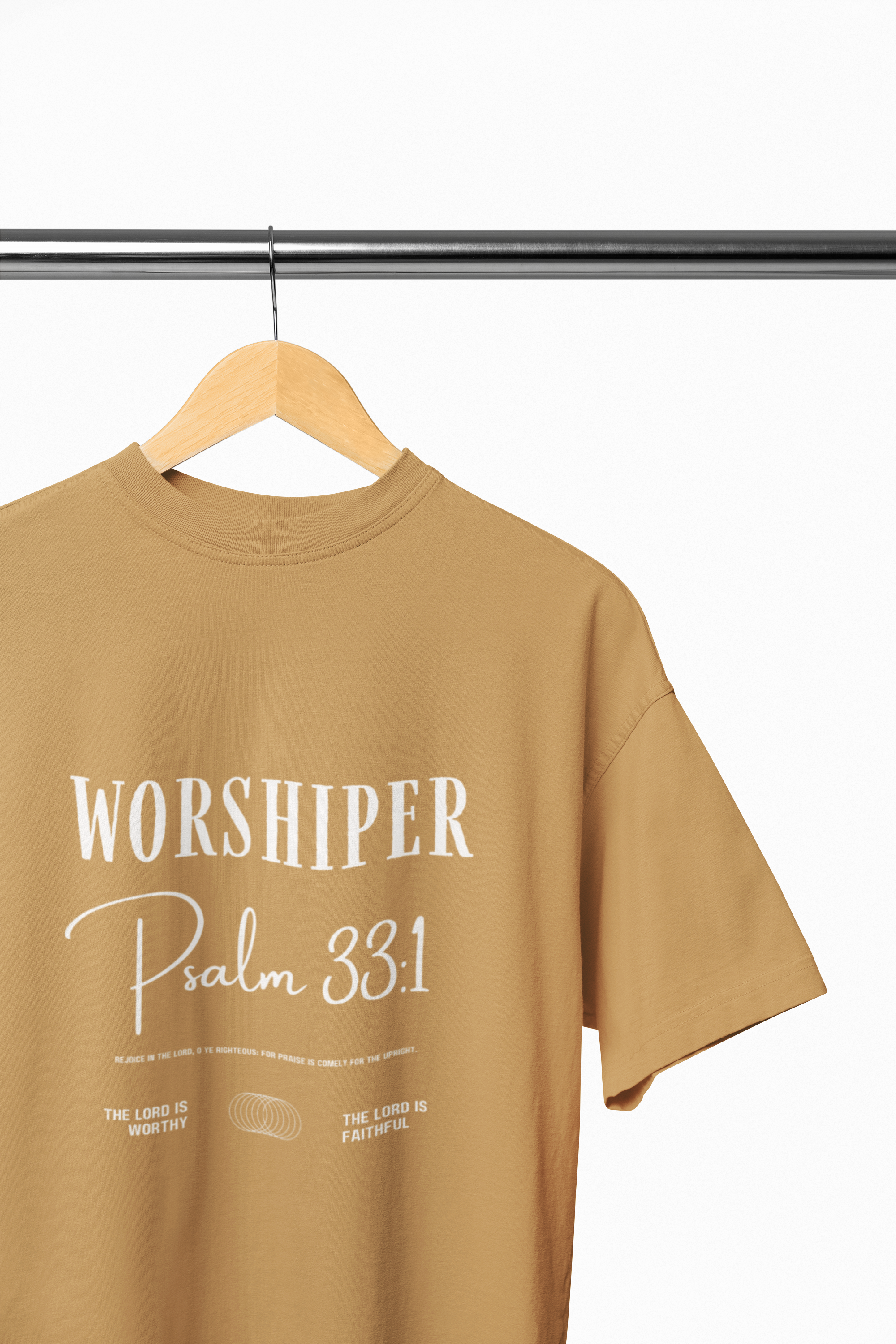 gold t-shirt with 'Worshiper Psalm 33:1' text on a hanger against a white background